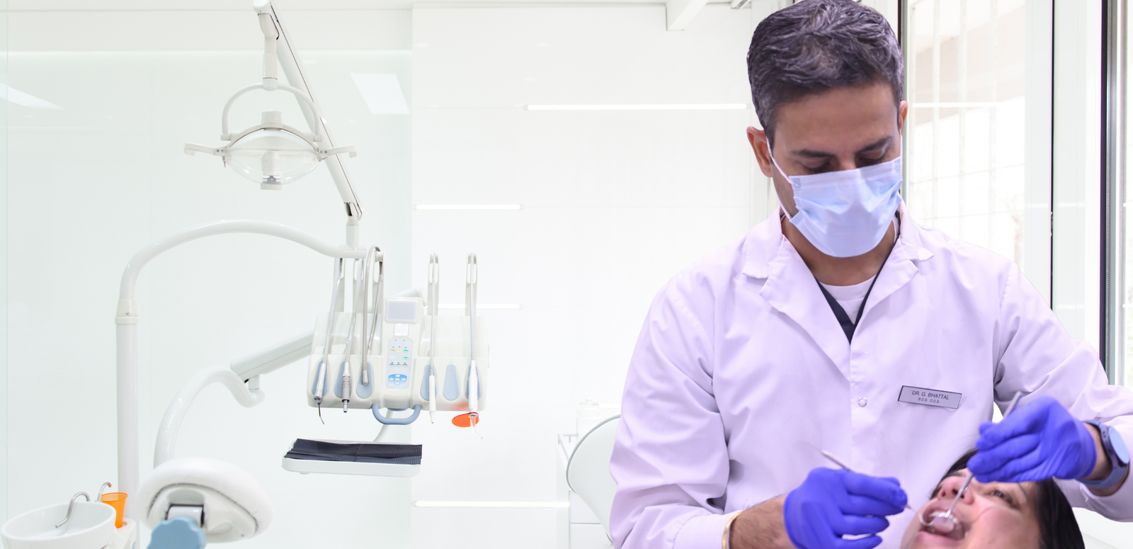 Dr. Bhattal treating a patient